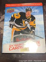 Cover of the Upper Deck Tim Hortons 2017-2018 NHL Hockey Collector's Album showing a hockey player in Pittsburgh Penguins uniform (Sidney Crosby).