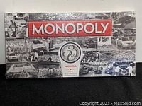 Front view of sealed Monopoly board game box with Honda 30th anniversary branding and collage of historic Honda images.