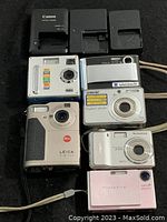 Overall view of three chargers above six cameras on black background