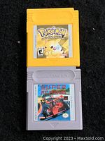 Two Nintendo Game Boy game cartridges shown. Top is Pokémon Special Pikachu Edition in yellow cartridge, bottom is Super R.C. Pro-Am in gray cartridge.