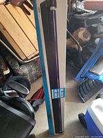 Photo of blacklight UV tube light in original box showing packaging and length marking (48 inches).