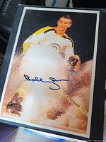 Autographed Bobby Orr Boston Bruins photo with signature on front.