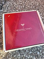 Red Siempre Vino branded box with logo on lid