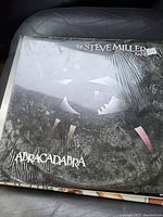Photo of vinyl record album 'Abracadabra' by The Steve Miller Band still in shrink wrap.