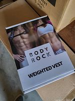 Box for Body Rock weighted vest featuring male and female torso images and text "Body Rock Weighted Vest".