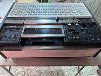 Top-down angled view of Sony U-Matic videocassette recorder model VO-2610 showing front panel controls and ventilation grilles on top.