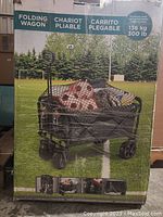 Boxed folding wagon showing product image and features, including capacity and foldable design.