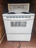Front view of the Kenmore electric cooking range showing the oven and control panel.