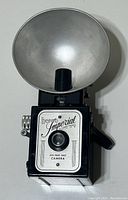 Front view of the Herco Imperial 620 Snap Shot camera showing the front plate and attached flash reflector