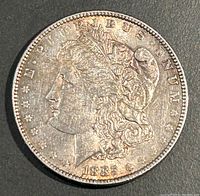Obverse side of 1885 Morgan Silver Dollar showing Lady Liberty and date