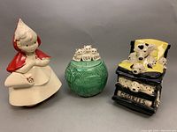 All three pottery cookie jars displayed together showing Little Red Riding Hood, Three Little Kittens, and Dalmatians