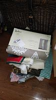Photo of packaged Residence brand curtain panels with label showing size and fabric pattern