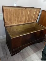 Open view showing cedar lined interior with ventilation slats and hinged lid.