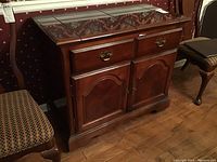 Front view of cherry-finished wooden buffet server