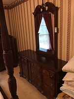 Full view of the wooden dresser with attached mirror, showing overall size and style.