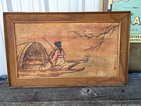 Full view of the framed antique Japanese silk painting depicting a woman on a boat with tree branches in background, showing overall condition and frame.
