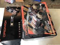 Dromida FPV Monster Truck box with product branding and images, showing truck, controller, and goggles.