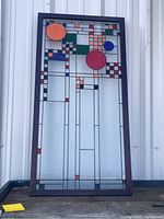 Full front view of stained glass panel showing overall design and frame