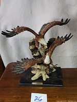 Front view of the Adeline Collection sculpture showing two bald eagles on a black base.
