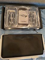 Top view of Casa Dolce 3-section buffet server with warming tray and instruction manual on top, also showing Westinghouse electric griddle's cooking surface