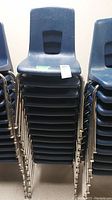 Front view of the full stack of chairs showing count and stacking