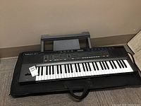 Full view of keyboard on soft case on floor