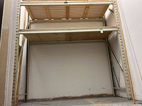 Front view of shelving unit showing two shelves and metal frame