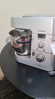 Front and side view of Kenwood Cooking Chef mixer on table