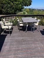 Full deck view showing rectangular table and all six chairs arranged around it