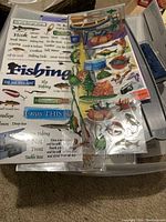 Fishing-themed stickers featuring detailed graphics and text related to fishing, camping, and outdoor activities.
