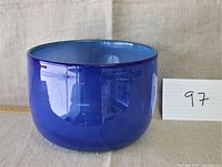 Blue glass bowl, side view showing rich blue color and round shape