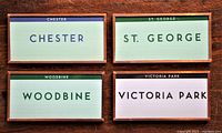 All four TTC subway station fridge magnets arranged in two rows showing Chester, St. George, Victoria Park, and Woodbine stations. Each magnet is copper trimmed with distinct header colors and tiled design.