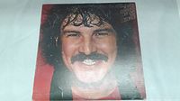 Front cover of the vinyl LP by Burton Cummings titled 'My Own Way to Rock' showing the artist's portrait.