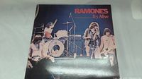Album cover showing Ramones performing live with band name and album title in red text.