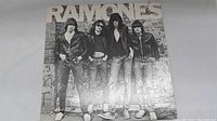 Front cover of the Ramones self-titled LP, showing the band members in leather jackets and 'RAMONES' title across the top.