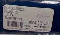 Box showing Weiser brand and label specifying model number GLA101 TC26D B 6LS1R1 Toluca Satin Chrome Hall/Closet SP lever