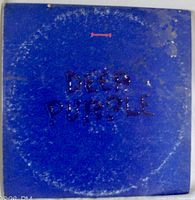 Front cover of Deep Purple Purple Passages album in blue with embossed title showing wear and signs of age.