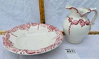 Photo of antique red transferware ceramic pitcher and matching bowl with measuring rulers showing approximate sizes, white ceramic with red design