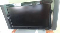 Front view of the Philips television, showing the 37-inch screen with black bezel and Philips logo on front below screen.