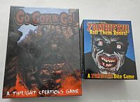 Front view showing Go Goblin Go! and Zombies!!! Roll Them Bones! games new and sealed in shrink wrap.