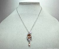 Full front view of necklace on mannequin showing pendant and chain length