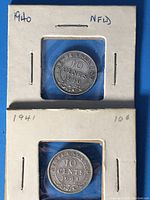 Front (reverse) side of 1940 and 1941 Newfoundland 10 cents silver coins in holders showing denomination and year