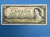 Front side of the 1954 Canadian $20 banknote featuring Queen Elizabeth II portrait and serial numbers.