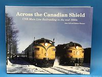 Cover of the hardcover railway book showing two yellow diesel locomotives on a train, title and subtitle visible.