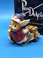 Side view of Pendelfin Cole rabbit figurine pulling wagon, with original Pendelfin box in background.