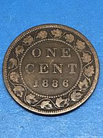 Reverse side of the 1896 Canadian large cent showing 'ONE CENT 1896' surrounded by maple leaf wreath.