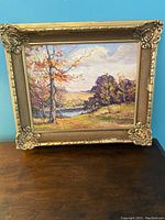 Front view of the oil painting and ornate gilt frame