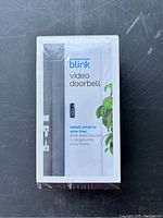 Front view of sealed white box showing Blink Video Doorbell and installation options.