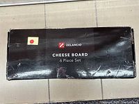 Photo of green and black Zelancio Cheese Board box indicating 6 piece set