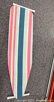 Top view of ironing board with striped fabric cover